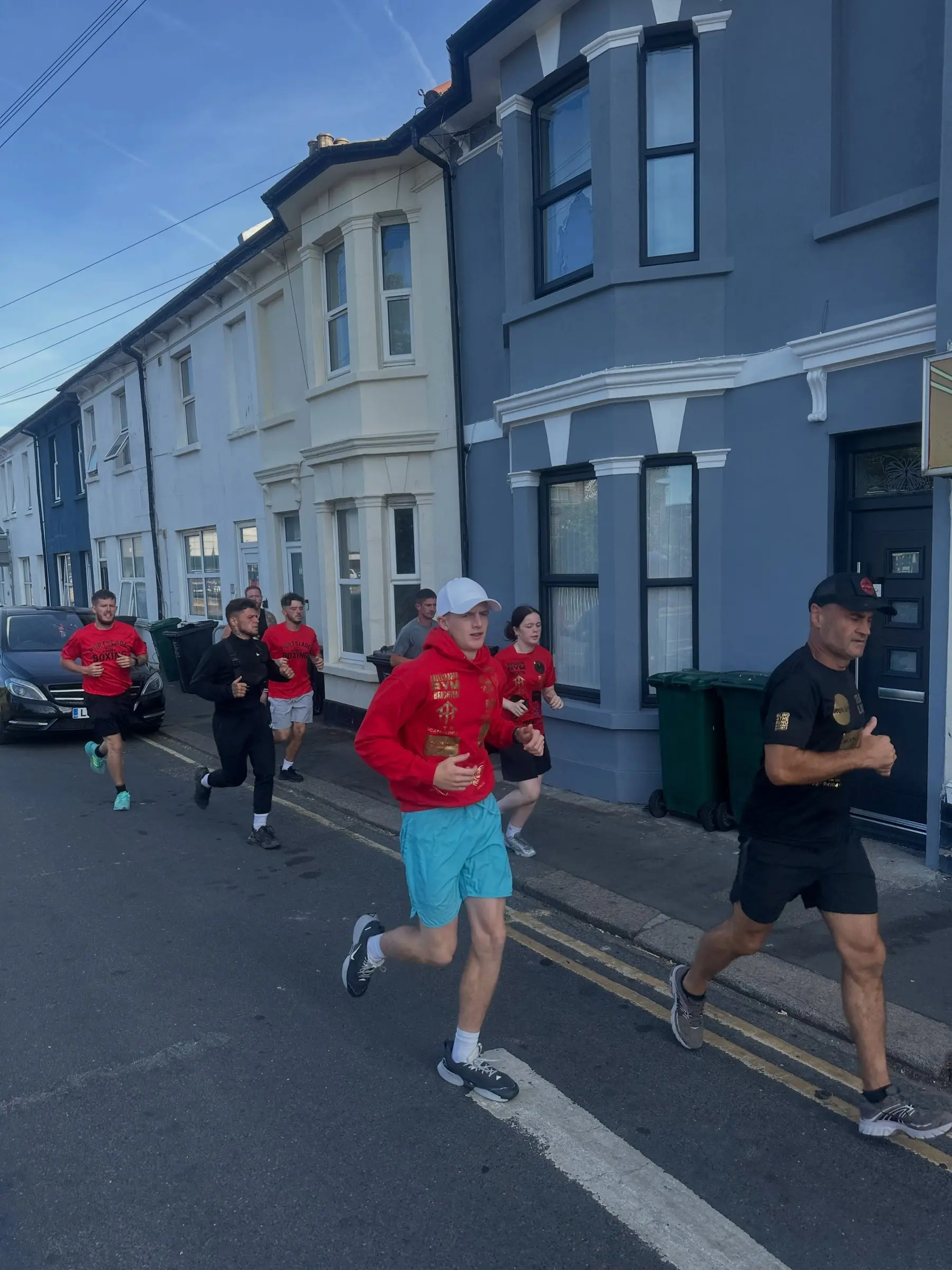 Club members running up a residential street